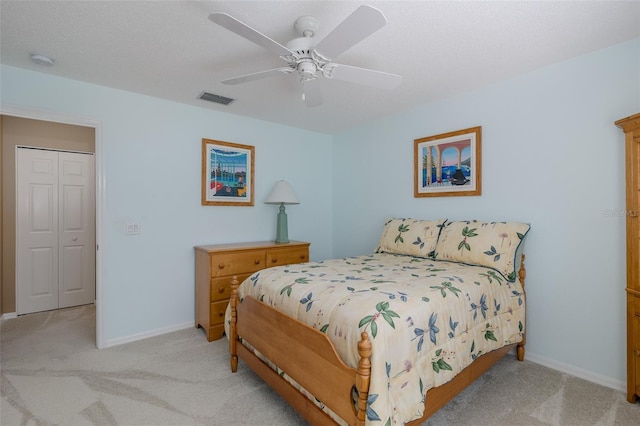 1105 Flora Vista St, New Port Richey, FL 34655 - bedroom with light carpet, baseboards, and ceiling fan
