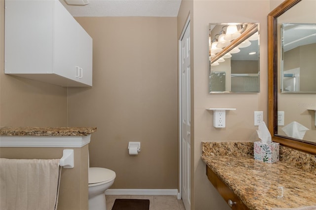 1105 Flora Vista St, New Port Richey, FL 34655 - bathroom with toilet, tile patterned floors, vanity, and baseboards