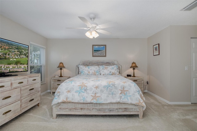 1105 Flora Vista St, New Port Richey, FL 34655 - bedroom with light carpet, baseboards, and ceiling fan