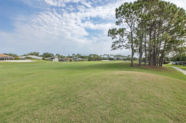 1105 Flora Vista St, New Port Richey, FL 34655 - view of property's community with a lawn, view of golf course, and a residential view