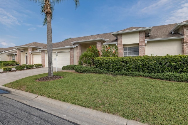1105 Flora Vista St, New Port Richey, FL 34655 - view of front of property featuring a garage, brick siding, a front lawn, driveway, and roof with shingles