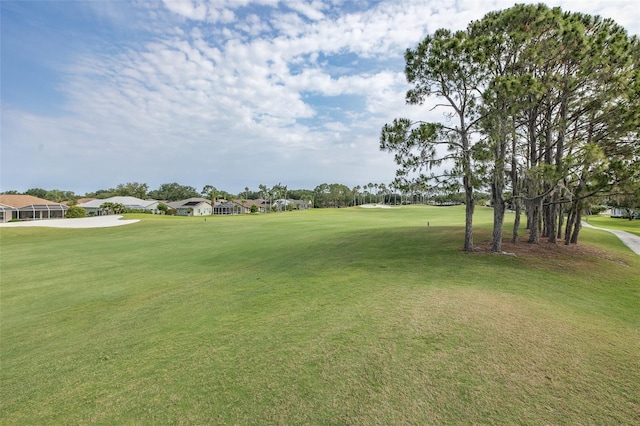 1105 Flora Vista St, New Port Richey, FL 34655 - view of home's community featuring view of golf course and a lawn