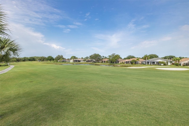 1105 Flora Vista St, New Port Richey, FL 34655 - surrounding community with a residential view, golf course view, a lawn, and a water view
