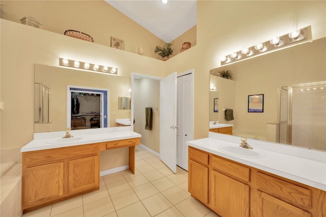 1009 Summer Breeze Dr, Brandon, FL 33511 - full bath with high vaulted ceiling, tile patterned floors, vanity, a garden tub, and a shower stall