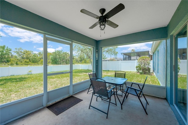 1009 Summer Breeze Dr, Brandon, FL 33511 - sunroom / solarium with ceiling fan and outdoor dining space