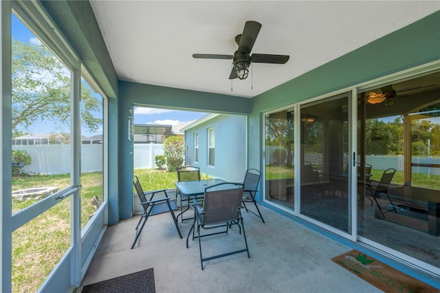 1009 Summer Breeze Dr, Brandon, FL 33511 - sunroom featuring a ceiling fan and outdoor dining space