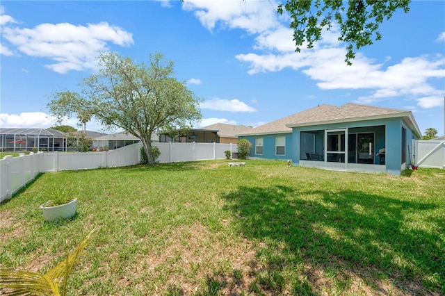 1009 Summer Breeze Dr, Brandon, FL 33511 - view of yard featuring a sunroom