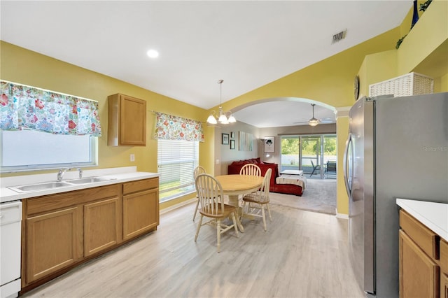 1009 Summer Breeze Dr, Brandon, FL 33511 - kitchen featuring a sink, freestanding refrigerator, white dishwasher, light wood-style flooring, and light countertops