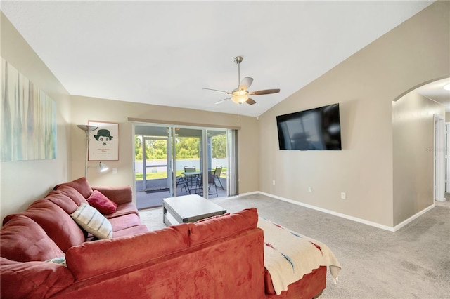 1009 Summer Breeze Dr, Brandon, FL 33511 - carpeted living area featuring arched walkways, a ceiling fan, baseboards, and vaulted ceiling