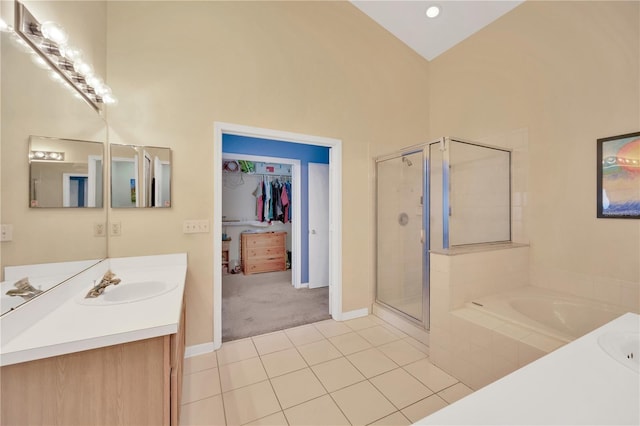 1009 Summer Breeze Dr, Brandon, FL 33511 - bathroom with vanity, a stall shower, a bath, tile patterned flooring, and a spacious closet