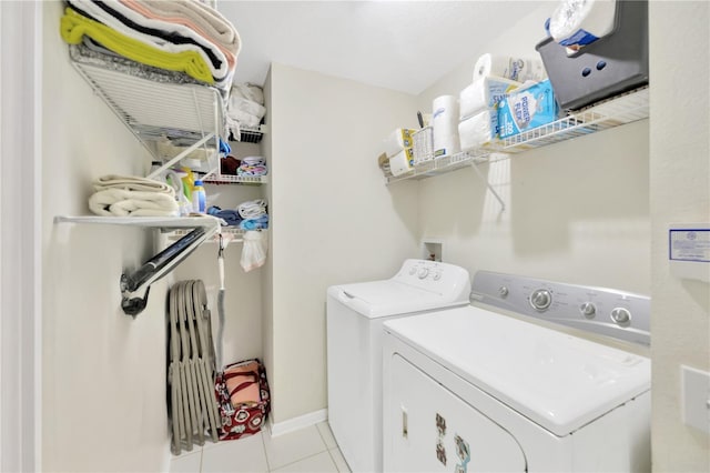 1009 Summer Breeze Dr, Brandon, FL 33511 - laundry area with washer and clothes dryer, tile patterned floors, and baseboards