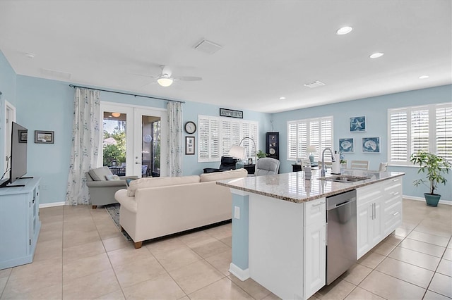 11308 Mollymawk Ct, New Port Richey, FL 34654 - kitchen with a sink, dishwasher, french doors, ceiling fan, and white cabinetry