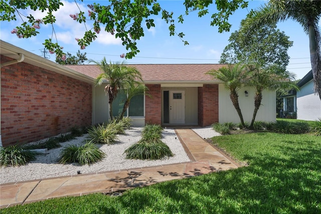 2866 Thistle Ct N, Palm Harbor, FL 34684 - view of front of home with brick siding and a front yard