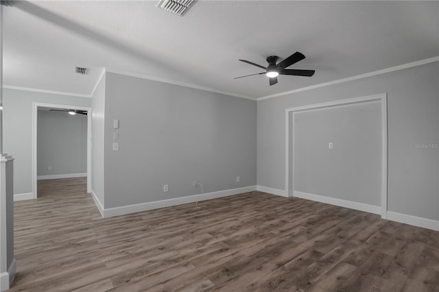 2866 Thistle Ct N, Palm Harbor, FL 34684 - empty room featuring a ceiling fan, wood finished floors, ornamental molding, and baseboards