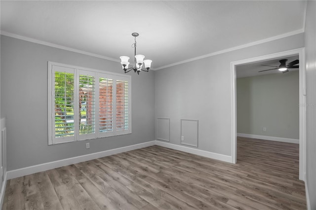 2866 Thistle Ct N, Palm Harbor, FL 34684 - spare room with crown molding, a chandelier, wood finished floors, baseboards, and ceiling fan