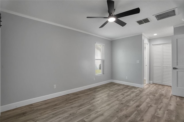 2866 Thistle Ct N, Palm Harbor, FL 34684 - empty room featuring ornamental molding, baseboards, a ceiling fan, wood finished floors, and recessed lighting