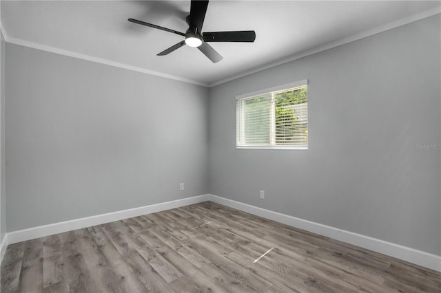 2866 Thistle Ct N, Palm Harbor, FL 34684 - empty room featuring ornamental molding, baseboards, wood finished floors, and a ceiling fan