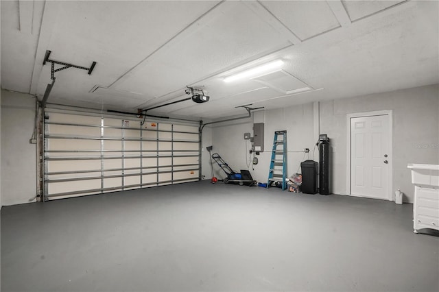 2866 Thistle Ct N, Palm Harbor, FL 34684 - garage featuring a garage door opener and electric panel