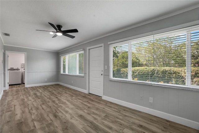 2866 Thistle Ct N, Palm Harbor, FL 34684 - unfurnished living room with crown molding, ceiling fan, baseboards, and wood finished floors