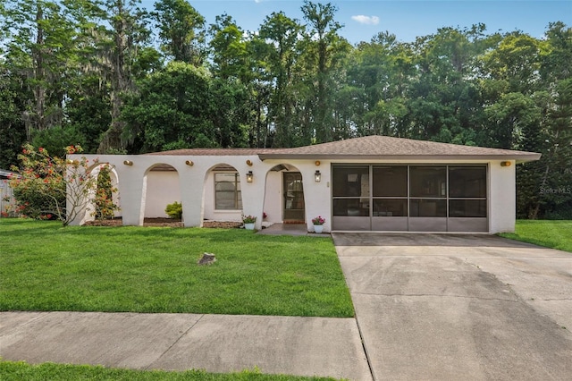 4424 Whitetail Ln, New Port Richey, FL 34653 - view of front of house with a front yard, stucco siding, and concrete driveway