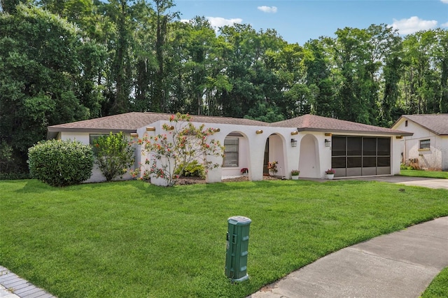 4424 Whitetail Ln, New Port Richey, FL 34653 - view of front of house featuring driveway, stucco siding, a front lawn, and a garage