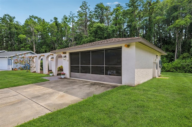 4424 Whitetail Ln, New Port Richey, FL 34653 - view of front of house featuring stucco siding, a front lawn, and a patio