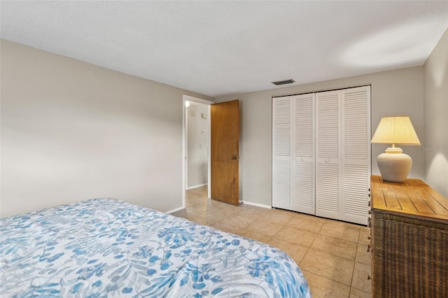 4424 Whitetail Ln, New Port Richey, FL 34653 - bedroom with light tile patterned floors, baseboards, and a closet