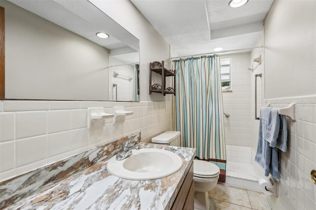 4424 Whitetail Ln, New Port Richey, FL 34653 - bathroom featuring tile walls, toilet, a stall shower, tile patterned floors, and vanity