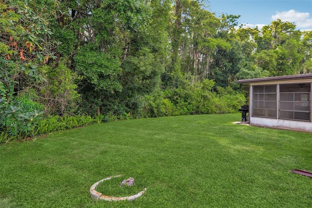 4424 Whitetail Ln, New Port Richey, FL 34653 - view of green lawn featuring a sunroom