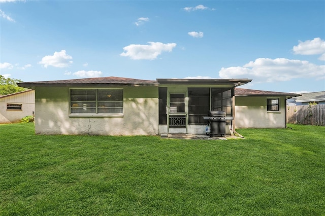 4424 Whitetail Ln, New Port Richey, FL 34653 - back of house featuring a sunroom and stucco siding