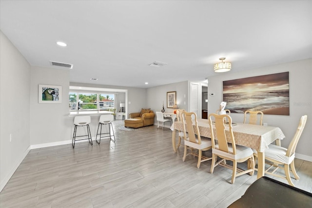 3907 Headsail Dr, New Port Richey, FL 34652 - dining area featuring wood finished floors and recessed lighting
