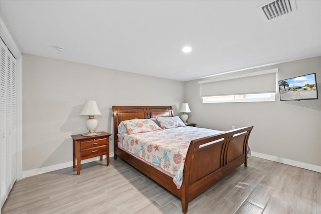 3907 Headsail Dr, New Port Richey, FL 34652 - bedroom featuring light wood-style flooring, recessed lighting, and a closet