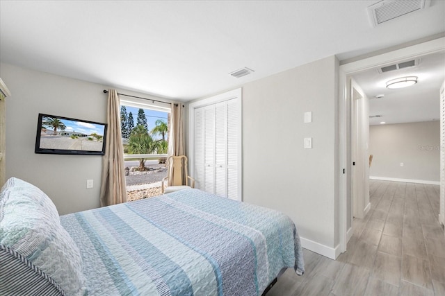3907 Headsail Dr, New Port Richey, FL 34652 - bedroom featuring light wood-style flooring and a closet