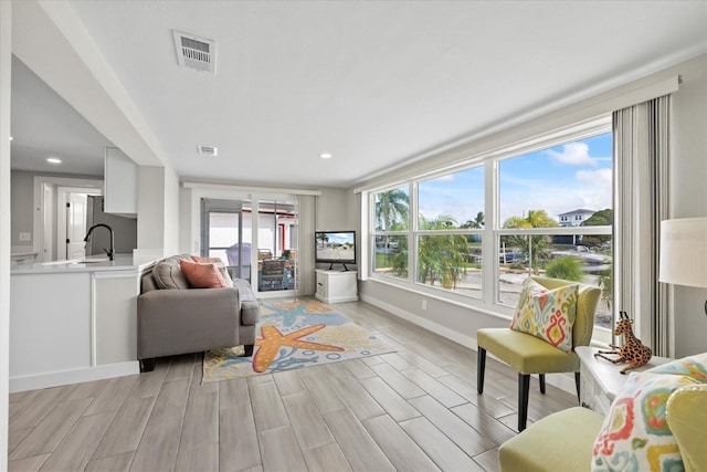 3907 Headsail Dr, New Port Richey, FL 34652 - living area with light wood finished floors and recessed lighting