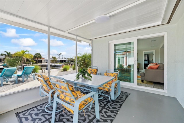 3907 Headsail Dr, New Port Richey, FL 34652 - sunroom / solarium with outdoor dining space