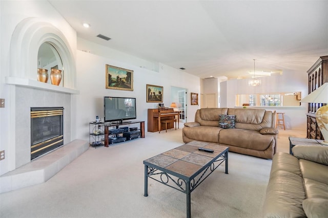 1407 Hickory Moss Pl, Trinity, FL 34655 - living area featuring a fireplace, carpet flooring, and a chandelier