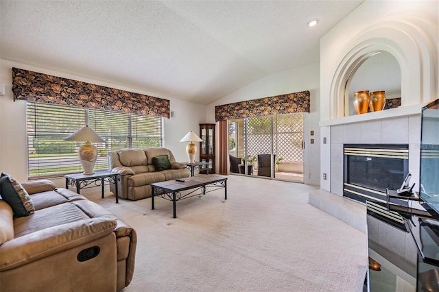 1407 Hickory Moss Pl, Trinity, FL 34655 - carpeted living room featuring vaulted ceiling, a tile fireplace, and a textured ceiling