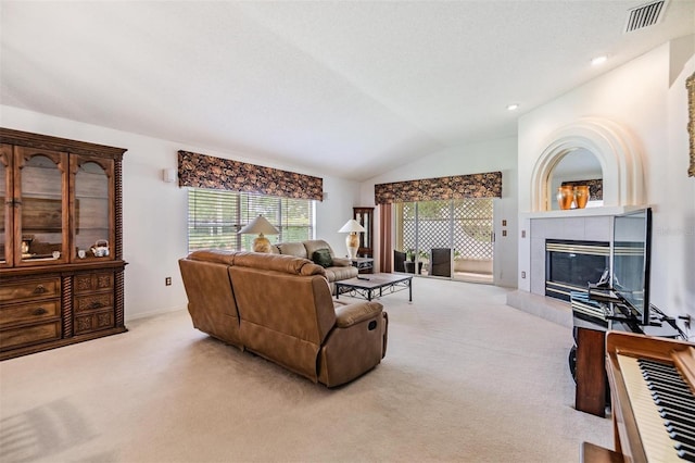 1407 Hickory Moss Pl, Trinity, FL 34655 - carpeted living room with a fireplace and lofted ceiling