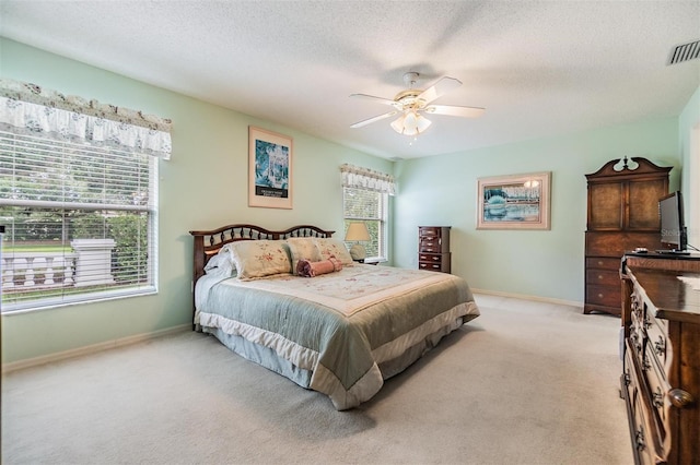 1407 Hickory Moss Pl, Trinity, FL 34655 - bedroom featuring light carpet, baseboards, a ceiling fan, and a textured ceiling