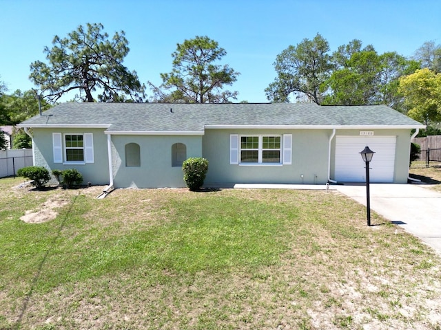 13180 Lawrence St, Spring Hill, FL 34609 - single story home featuring driveway, an attached garage, stucco siding, and roof with shingles