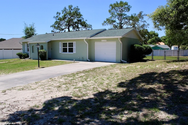 13180 Lawrence St, Spring Hill, FL 34609 - single story home featuring an attached garage, driveway, and stucco siding