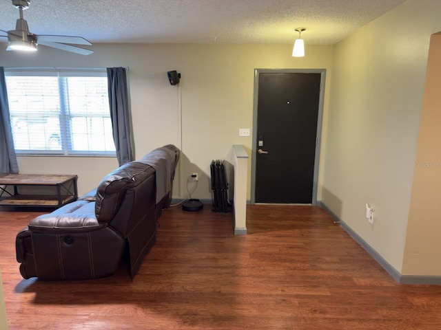 13180 Lawrence St, Spring Hill, FL 34609 - entryway featuring a ceiling fan, a textured ceiling, wood finished floors, and baseboards