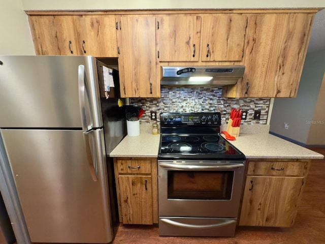 13180 Lawrence St, Spring Hill, FL 34609 - kitchen featuring stainless steel appliances, under cabinet range hood, decorative backsplash, and wood finished floors