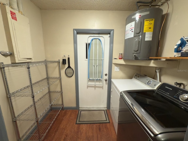 13180 Lawrence St, Spring Hill, FL 34609 - laundry area with water heater, washer and clothes dryer, wood finished floors, a textured ceiling, and baseboards