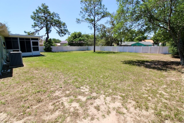 13180 Lawrence St, Spring Hill, FL 34609 - view of yard with a sunroom and central AC