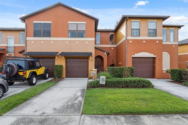 1108 Blackwater Dr, Wesley Chapel, FL 33543 - townhome / multi-family property with a garage, driveway, and stucco siding