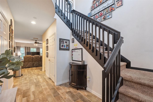 1108 Blackwater Dr, Wesley Chapel, FL 33543 - stairs featuring wood finished floors, a ceiling fan, and baseboards