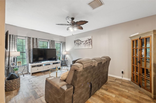 1108 Blackwater Dr, Wesley Chapel, FL 33543 - living room featuring wood finished floors, ceiling fan, and baseboards