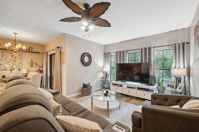 1108 Blackwater Dr, Wesley Chapel, FL 33543 - living area featuring a chandelier, wood finished floors, ceiling fan, and baseboards