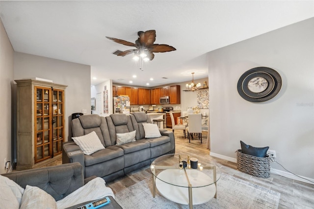 1108 Blackwater Dr, Wesley Chapel, FL 33543 - living area featuring a ceiling fan, light wood finished floors, recessed lighting, a chandelier, and baseboards